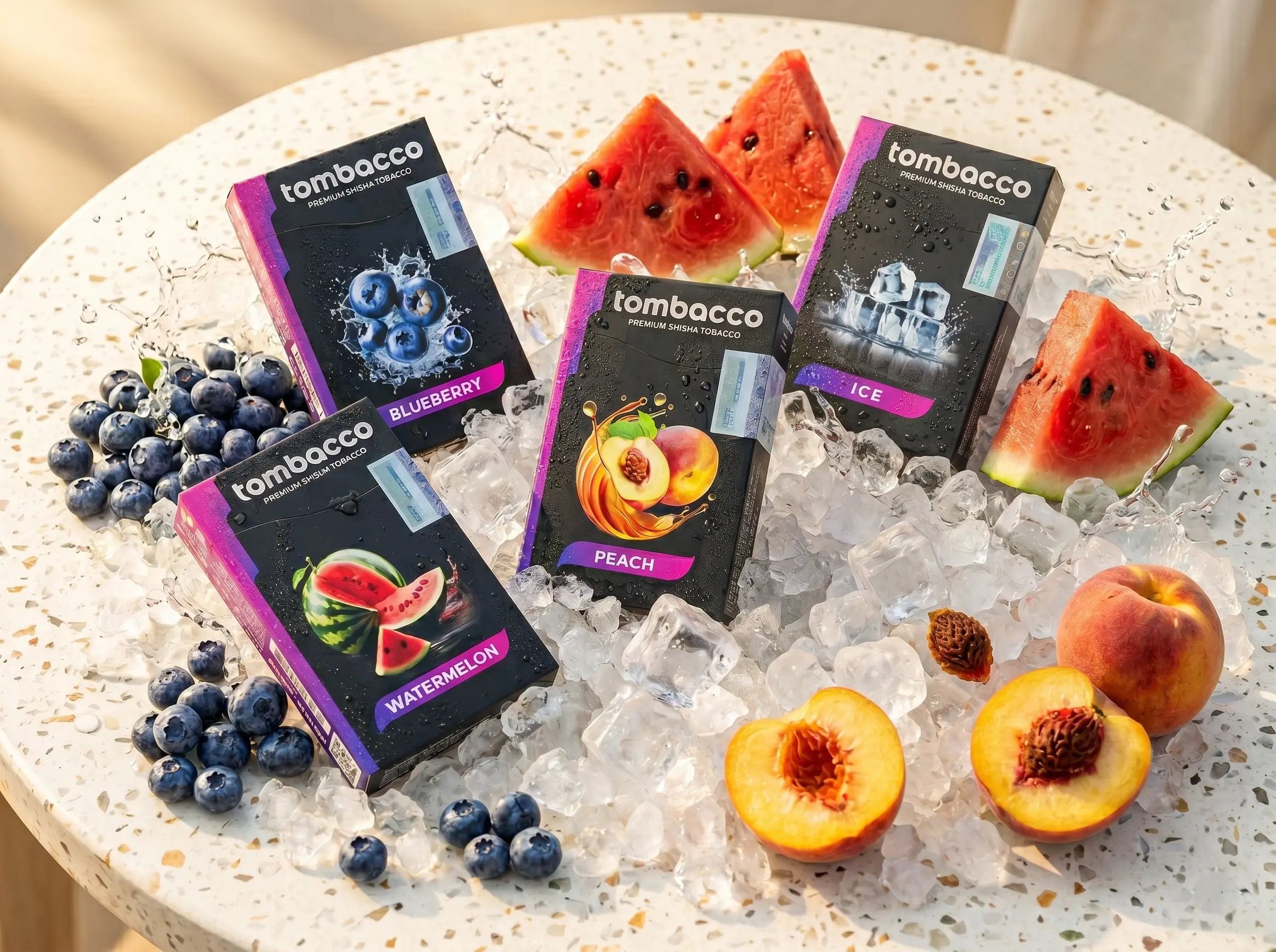 A refreshing display of premium Tombacco shisha boxes, including blueberry, watermelon, and peach, resting on ice for a tropical hookah bali mix.