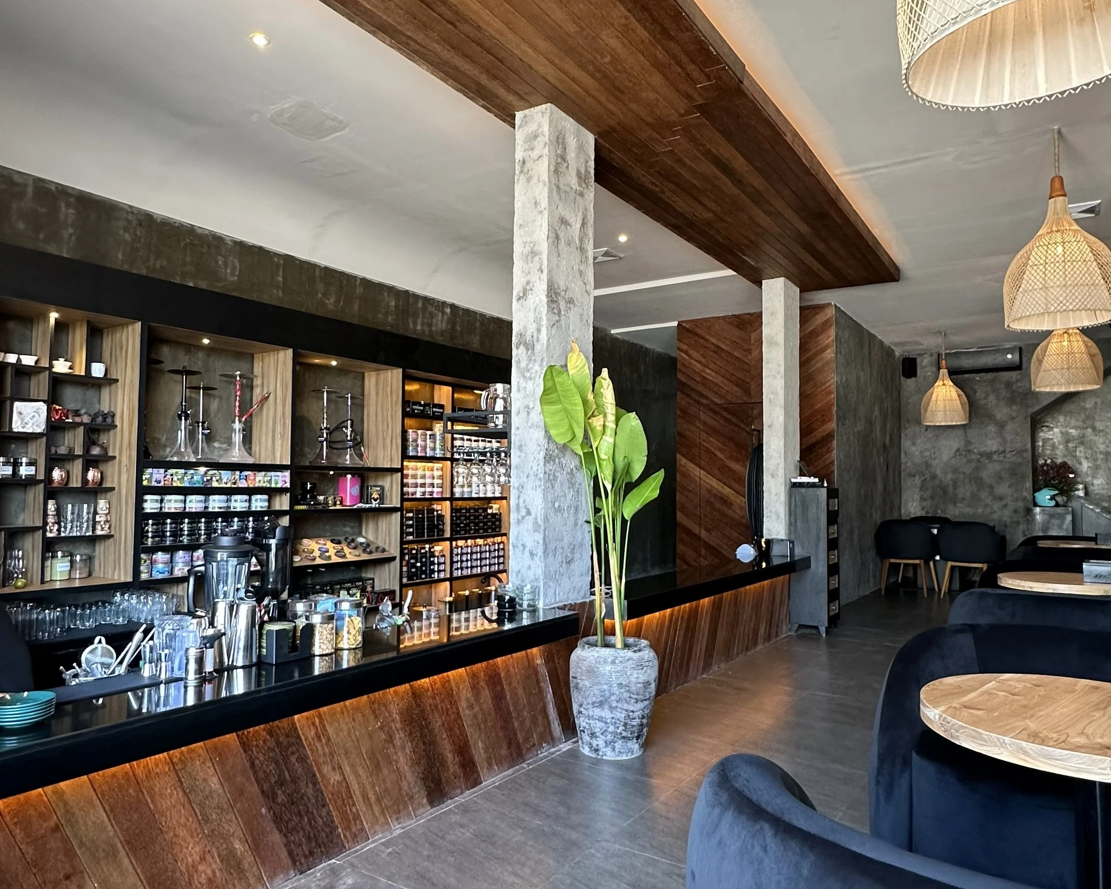 Sleek bar counter at Eden Hookah Club Uluwatu featuring a dedicated retail section, offering a great clifftop location to buy shisha in Bali