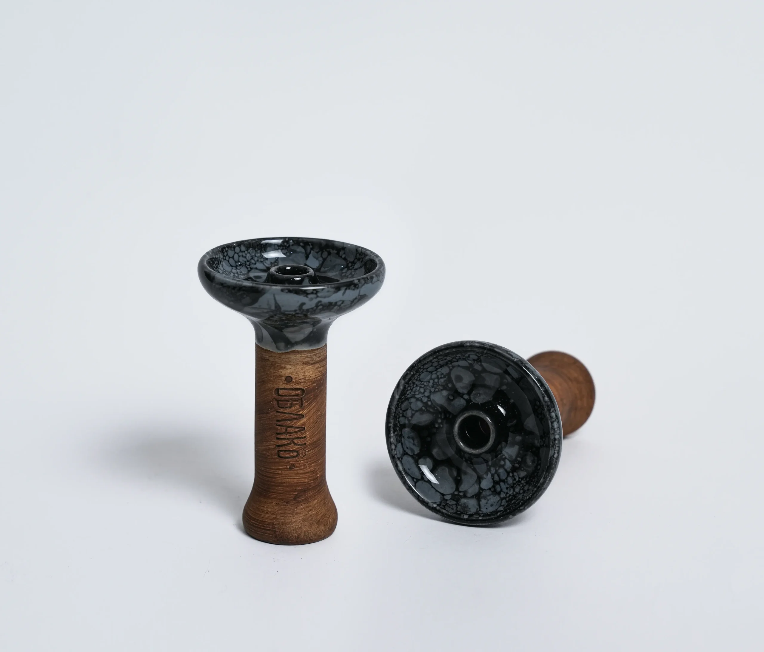 A stunning Oblako Phunnel bowl with a grey marble glaze and a single central open spire. This is widely considered one of the most popular hookah bowl types for keeping your session incredibly juicy and flavorful.